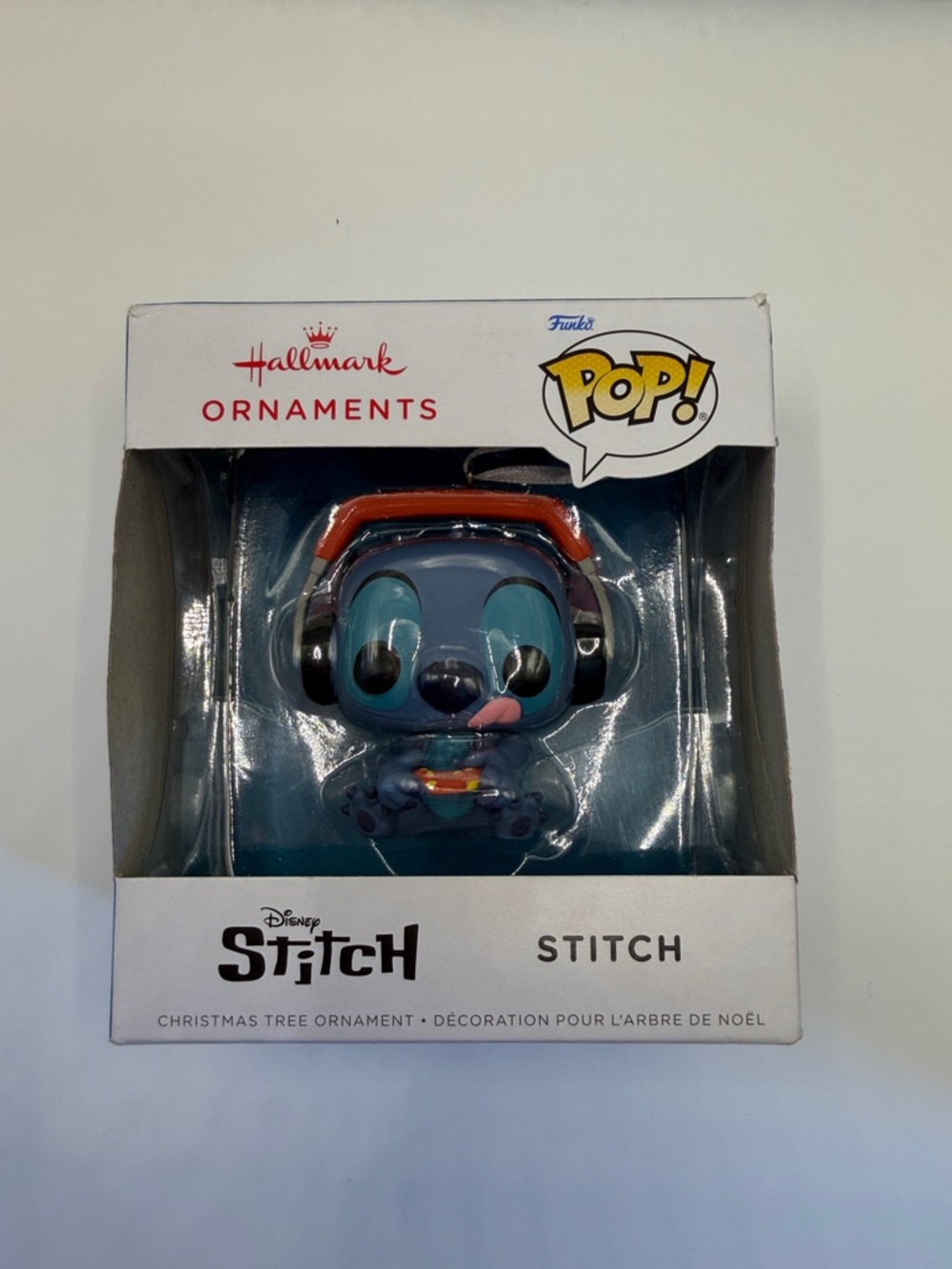 Hallmark Stitch Ornament with Orange Headphones and Blue Figure